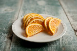 Free Stock Photos for Blogs - Cut Oranges on a Plate 1